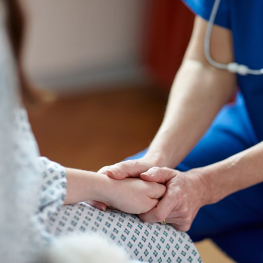 HCP holding patients hand